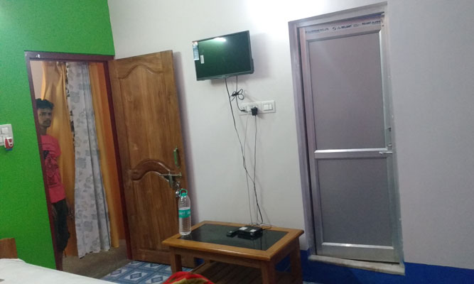 Trinayani Homestay attached bathroom including Tv and tea table