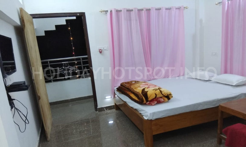 Babusona Homestay double beded bedroom at Jaldapara