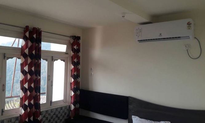 Home Tourism Center homestay bedroom with AC at Sutankhola or suntalekhola