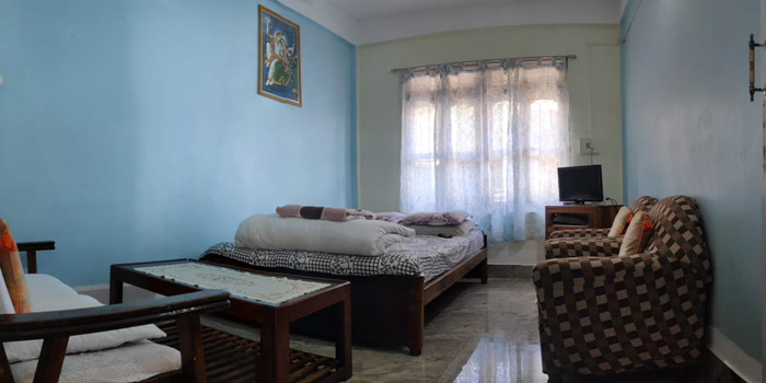 Jaldakha home stay big bed room with tv and sofa