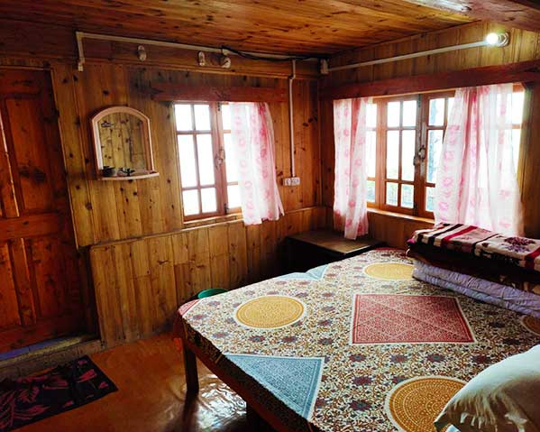 Triple bed room at khinanam kabiraj homestay at dawaipani